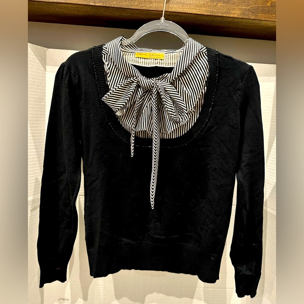 Black sweater with ruffles blouse insert